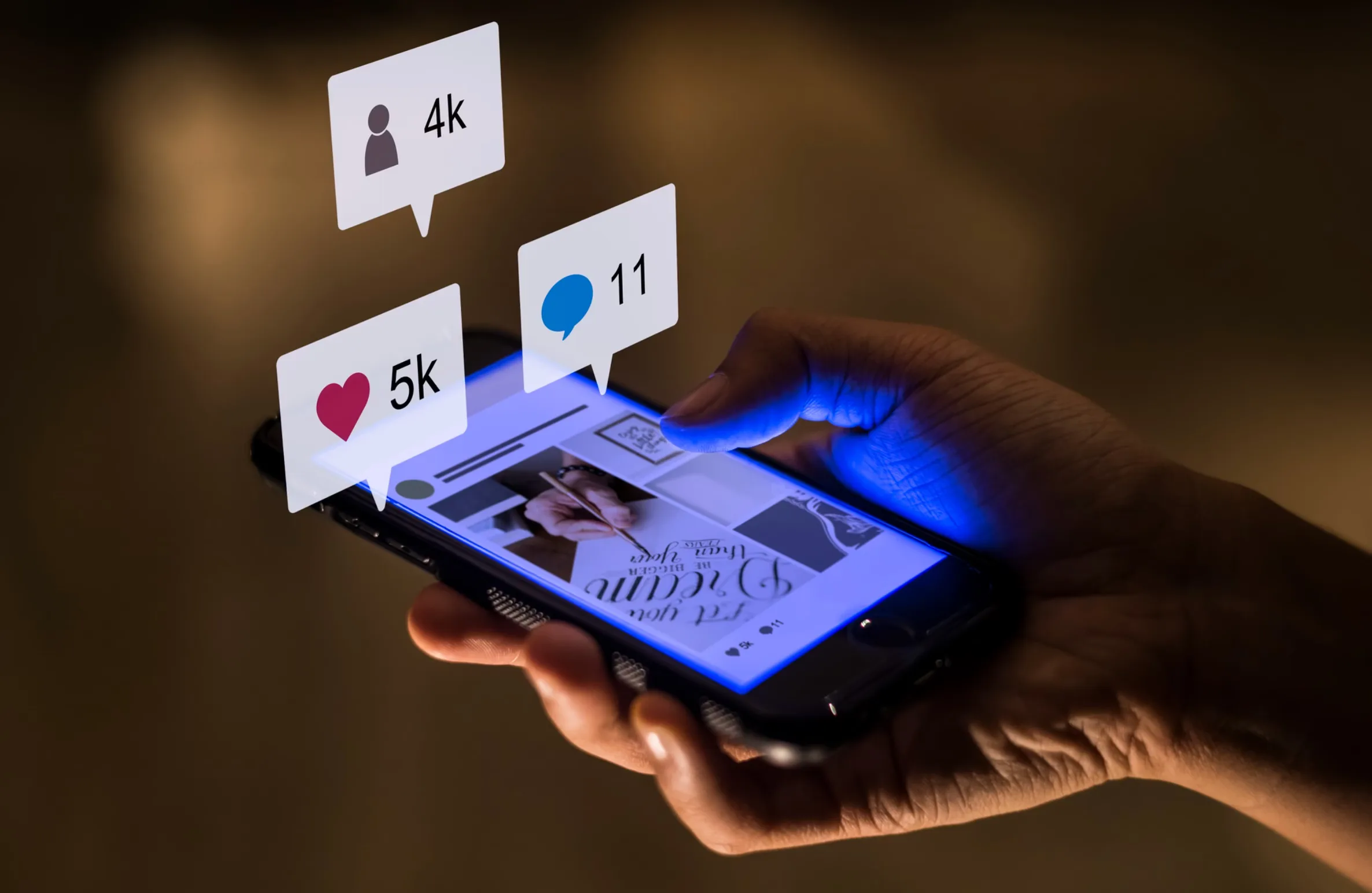 Hand holding a smartphone with social media engagement icons for likes, followers, and comments – showcasing the impact of Meta Ads Partner Excellence Program Hyderabad 2025