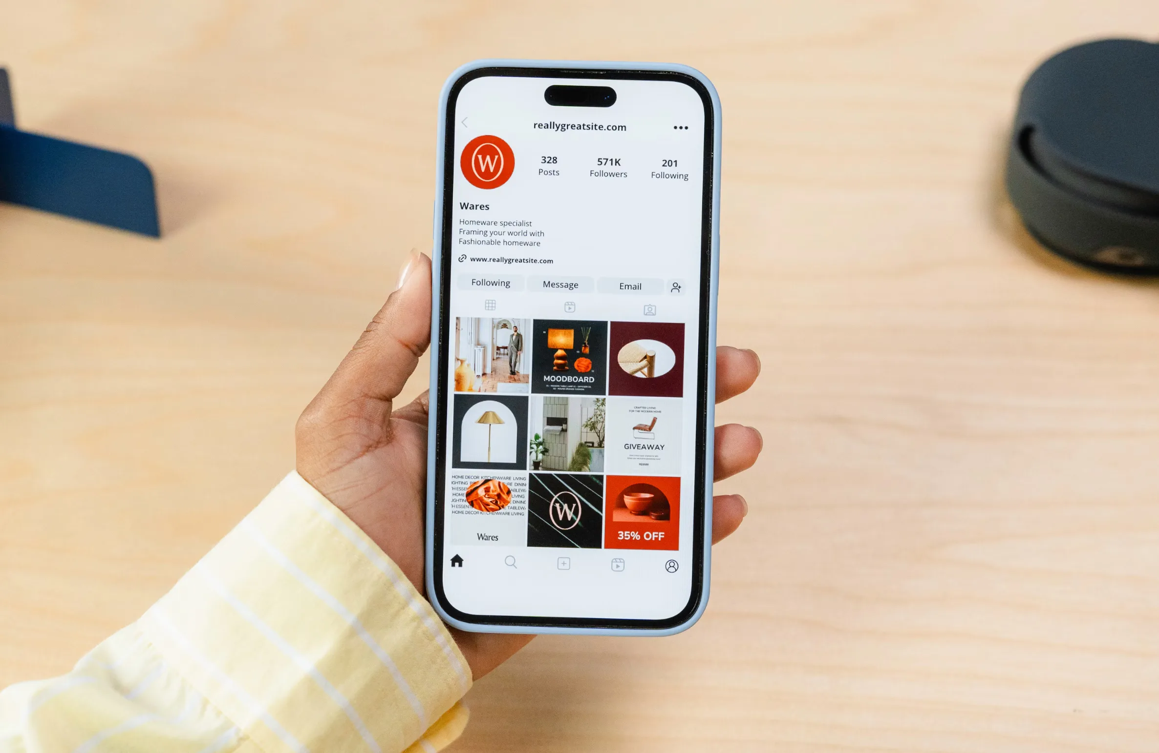 Person holding a smartphone displaying an Instagram profile, representing digital branding – relevant to the Top 10 Social Media Marketing Agencies in Hyderabad.