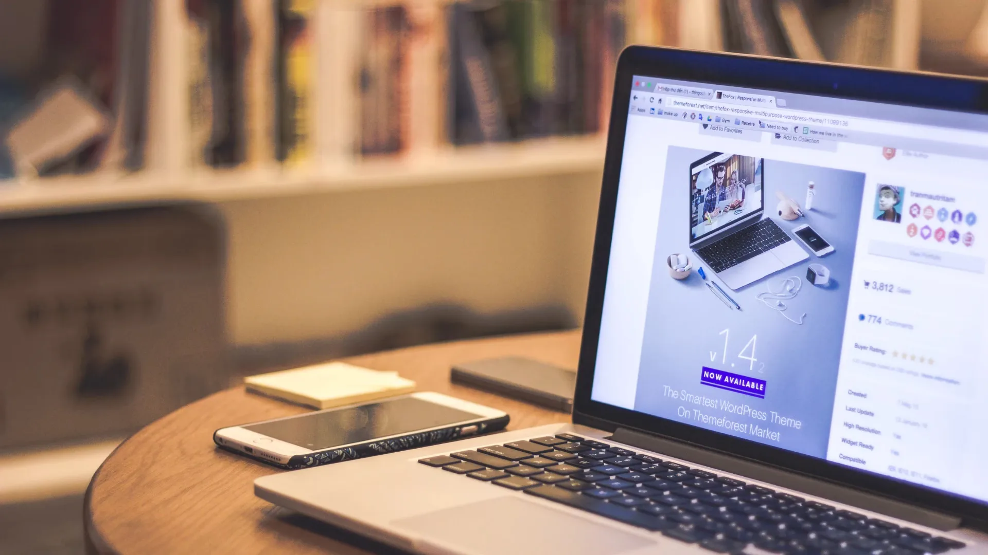 Open laptop on a desk displaying a website design interface, with a smartphone and stationery nearby, representing modern web design trends used by Hyderabad agencies in 2025.